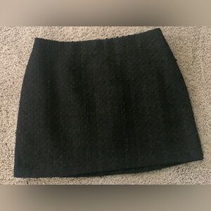 Short black skirt by H & M. Size 8.